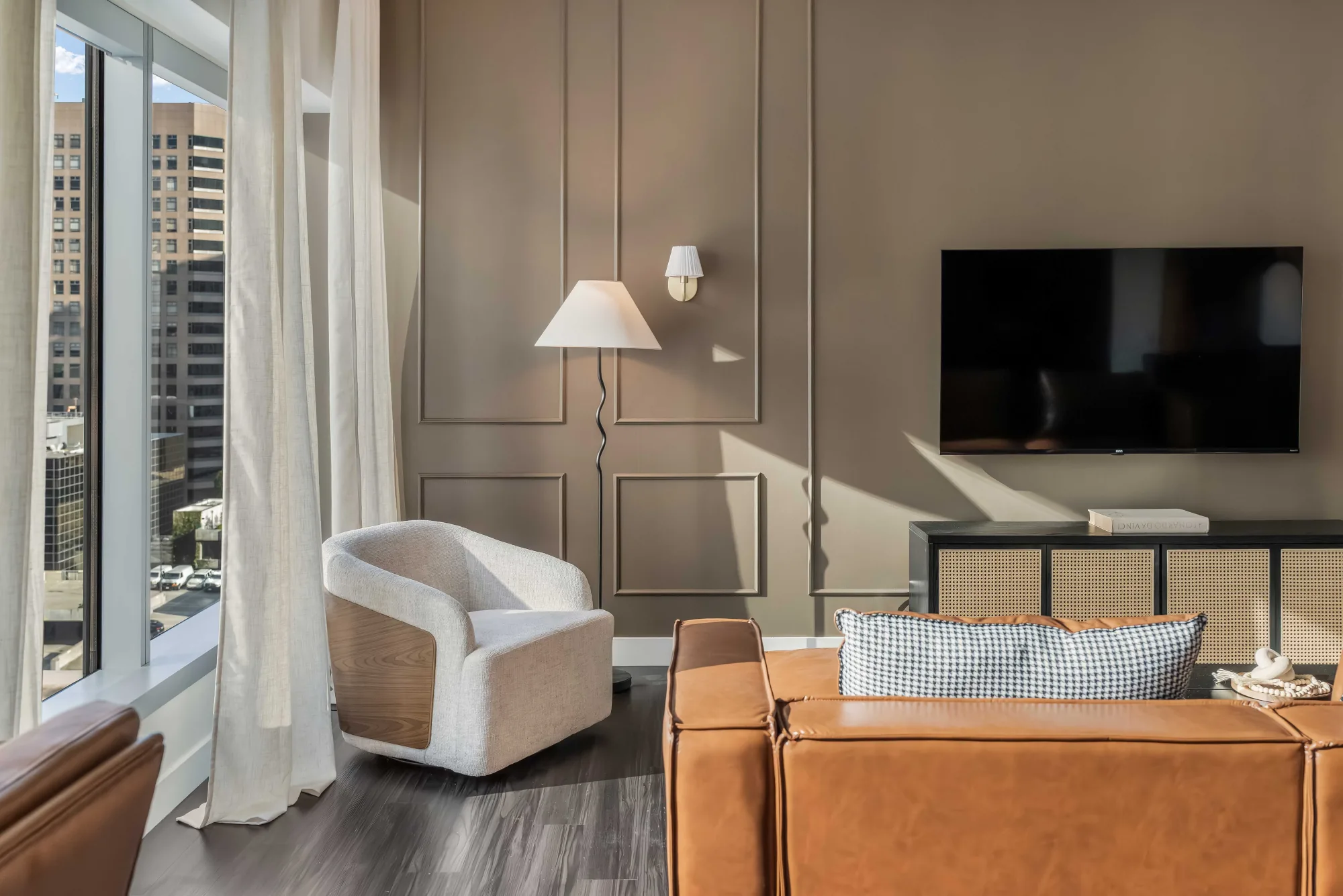 Los Angeles living room with paneled wall and city view