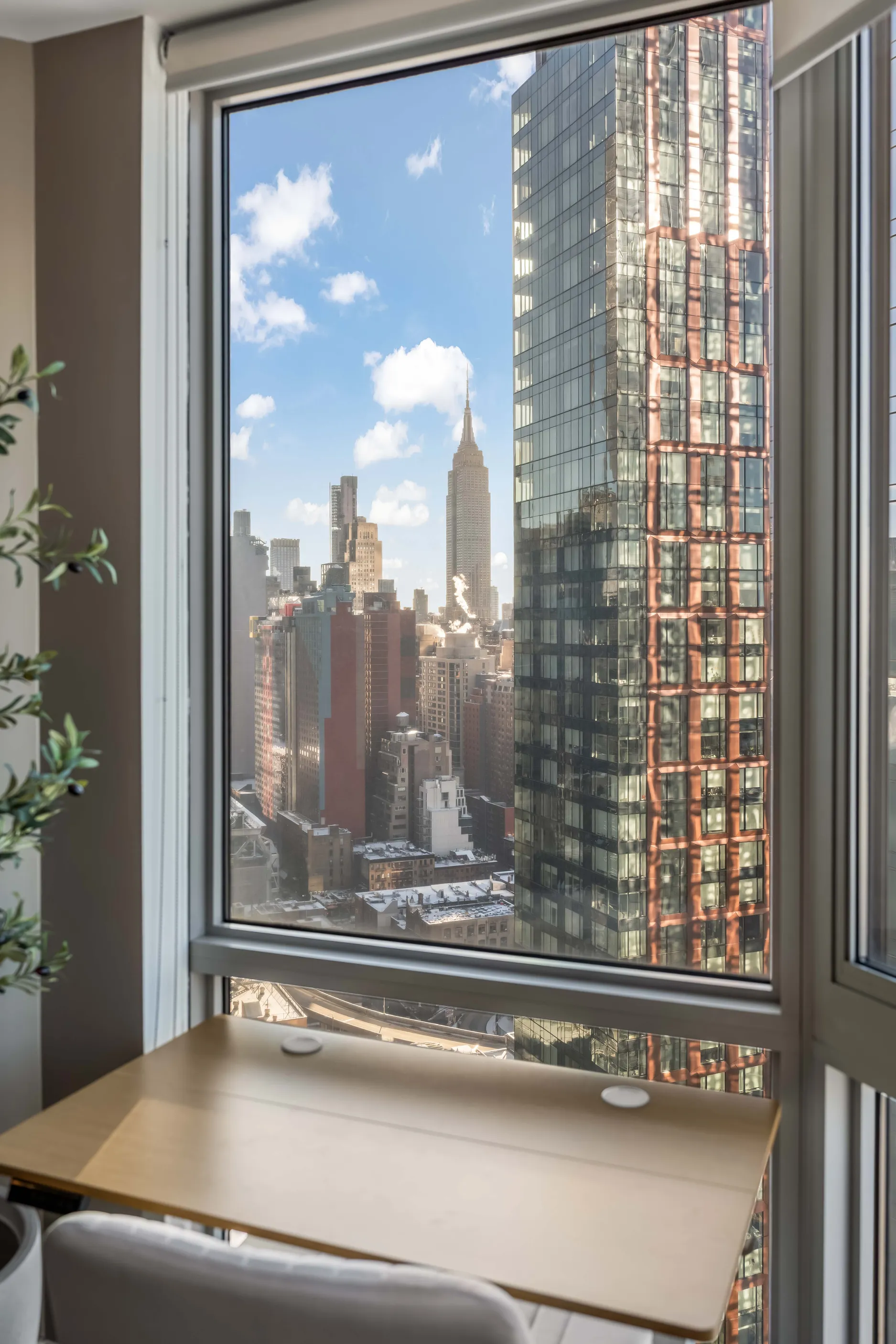 NYC interior with Empire State view